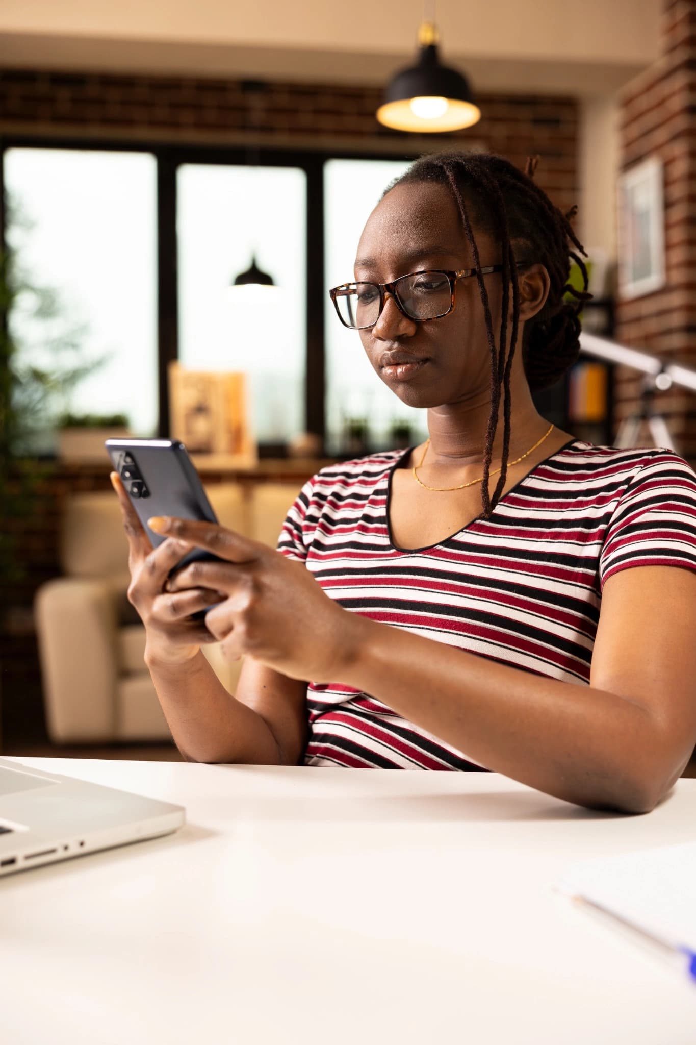 Business user checking mobile communication on a smartphone
